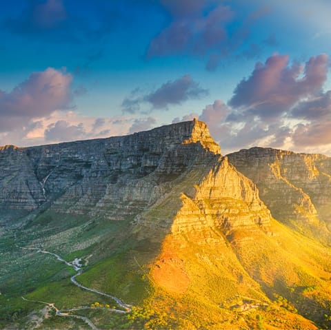 Hike up the gorgeous Table Mountain, or relax on the sandy bay below and go for a swim – just a twenty minute drive away