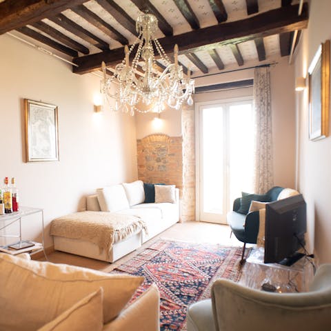 Take a moment to unwind with a good book in the comfortable living space