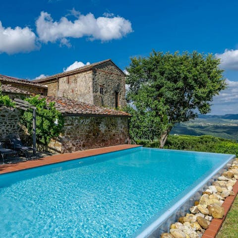 Admire beautiful views of the rolling hills from the private pool