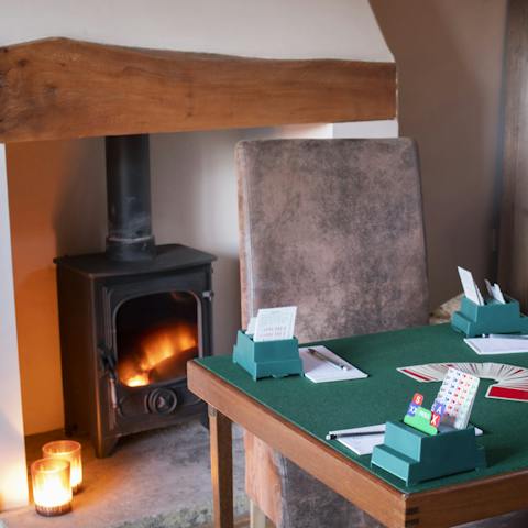 Spend evenings playing games in front of the log burner