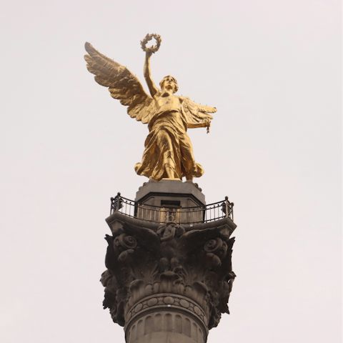 Take a short taxi ride to the Angel of Independence