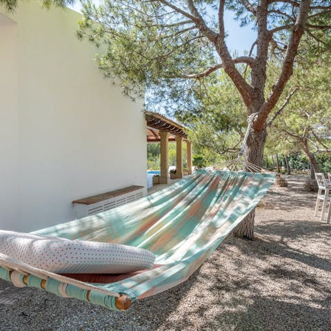 Take in the scent of the pine trees as you relax in the hammock