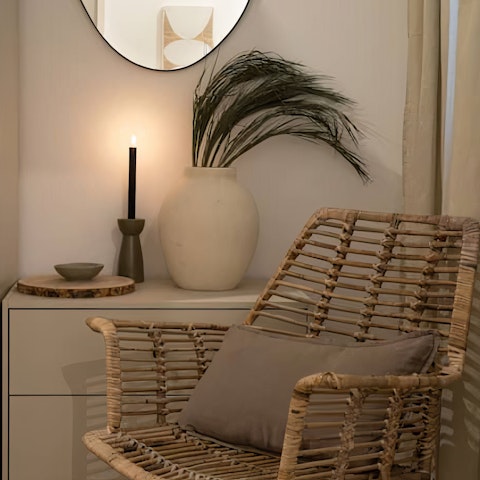 Kick back in the wicker armchair with a book from your host's collection