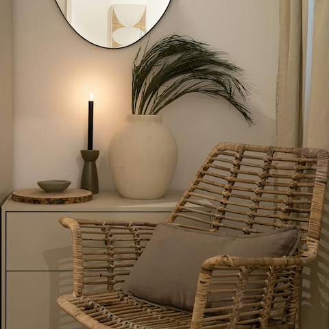 Kick back in the wicker armchair with a book from your host's collection