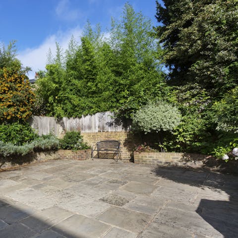 Enjoy an aperitif in the sunny courtyard garden