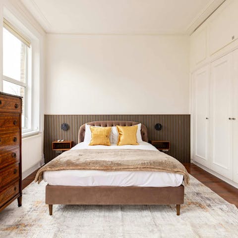 Sink into the comfortable bed after a day exploring the city