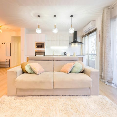 Enjoy a glass of Champagne in the open-plan living room