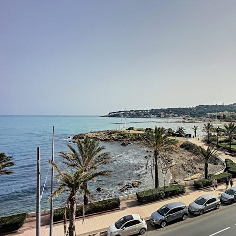 Admire the views from the balcony over the sandy Ilette Beach