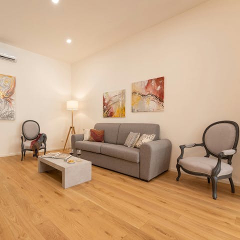 Flip through a guidebook on the comfy sofa