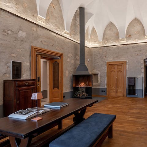 Relax in front of the fire in the communal lounge after a busy day