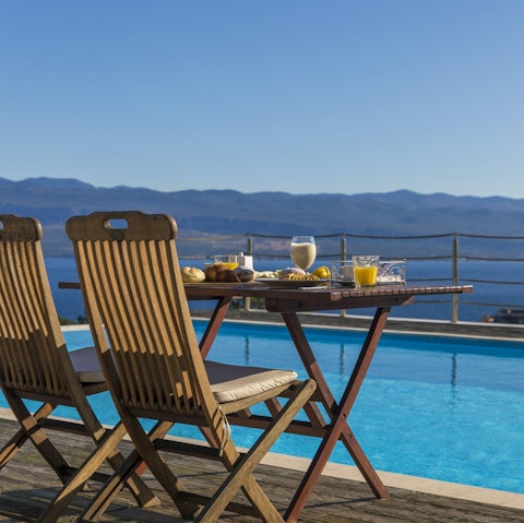 Soak up ocean views while topping up your tan by the pool