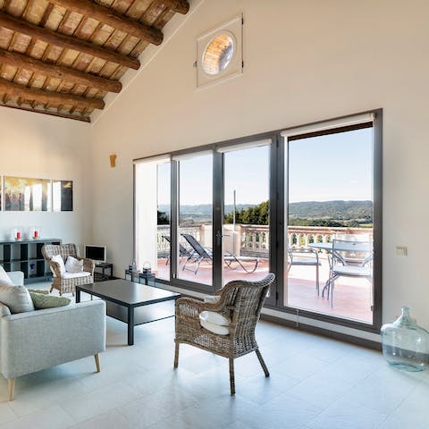 Open the balcony doors and admire views across the surrounding countryside