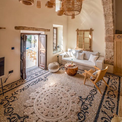 Relax with a good book and a glass of wine in the home's soothing interior