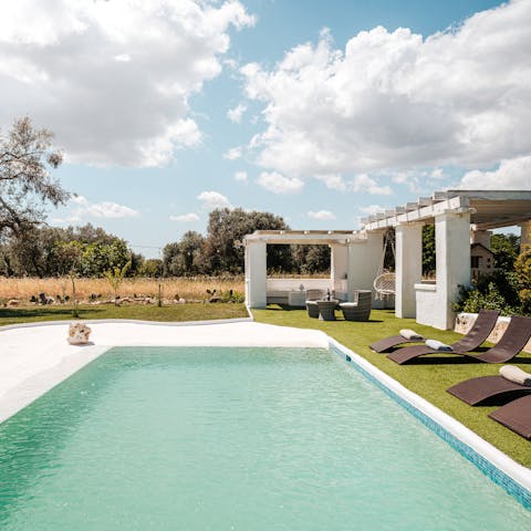 Sunbathe on the recliners or take a dip in the swimming pool