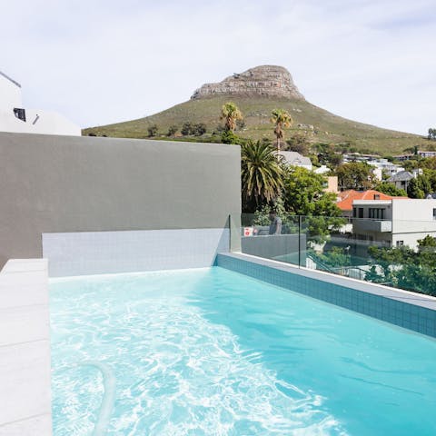 Swim in the private pool with the backdrop of Lion's Head