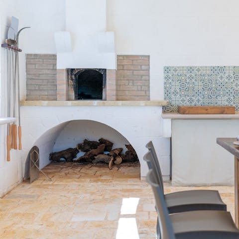 Fire up the wood burning stove and barbecue some fresh meat or cook a pizza to enjoy alfresco