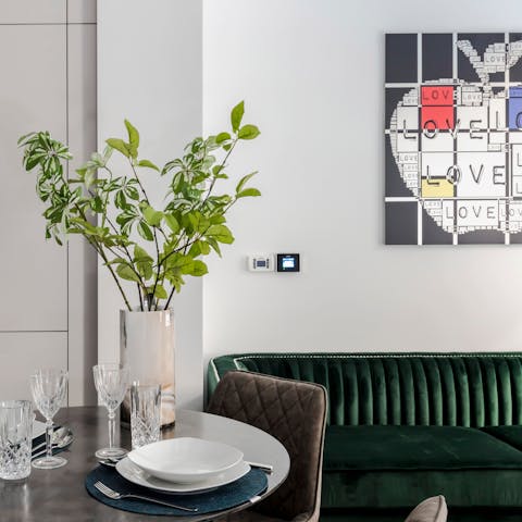 Enjoy homely touches like modern art on the walls and striking mid-century furniture