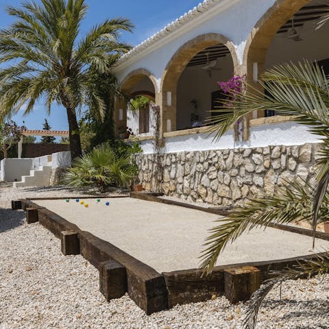 Enjoy a game of petanque with your loved ones as the sun warms your skin