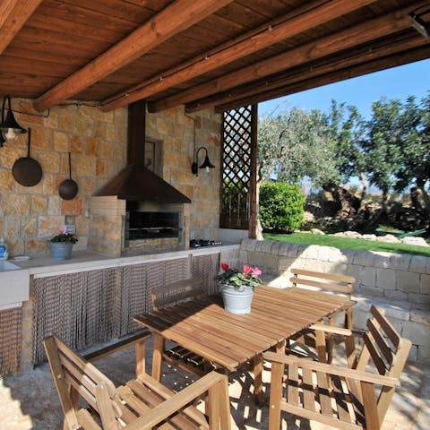 Gather for a barbecue as the sun sets
