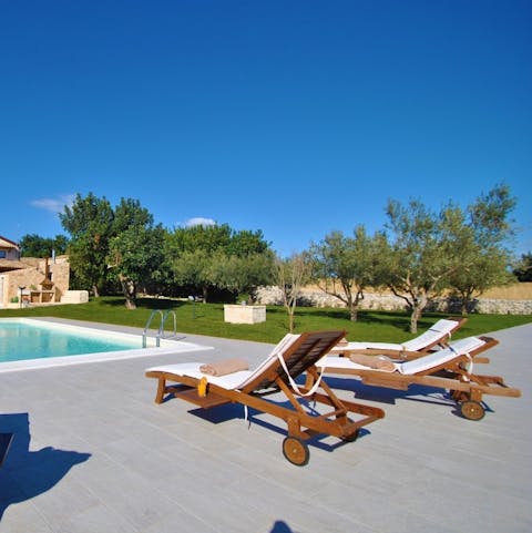 Soak up the sun by the pool