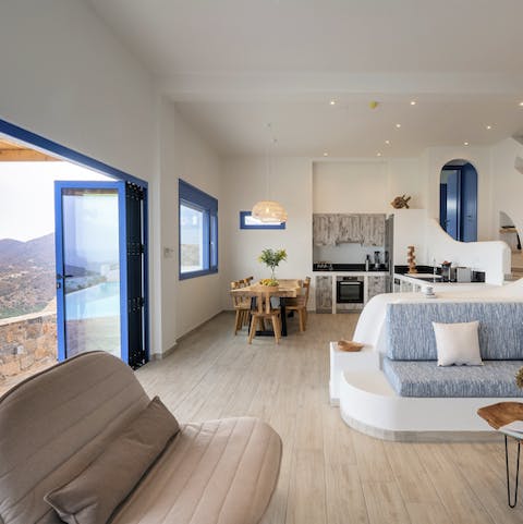 Open the bi-fold doors in the stylish living space and let the fresh sea air in