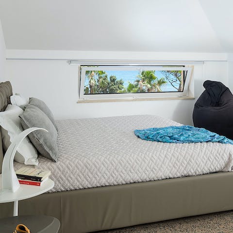 Wake up to serene views across the glistening sea