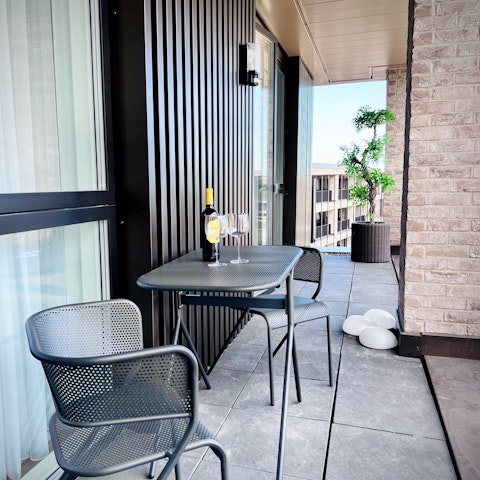 Unwind on the balcony with a glass of wine