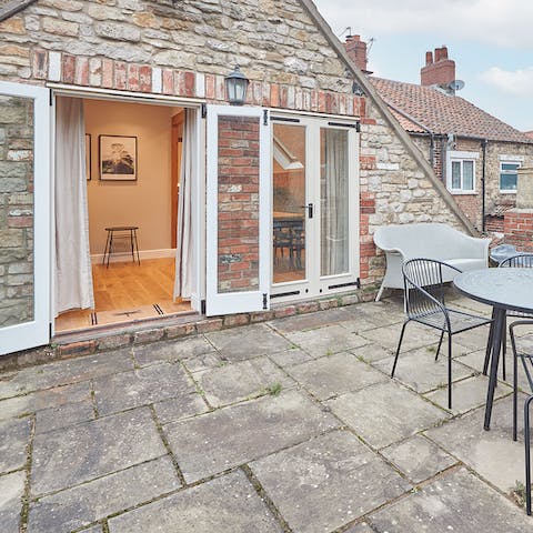 Pad outside with your morning coffee – the views of the surrounding trees and rooftops are a delight