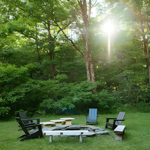 Sit around the firepit as the sun is setting – this home sits on the edge of 50 acres of woodland