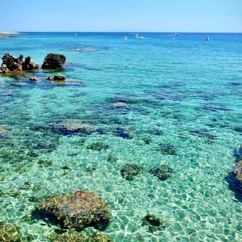 Swim in crystal waters at Coral Beach