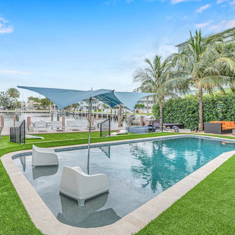 Relax and sunbathe by the shared heated pool