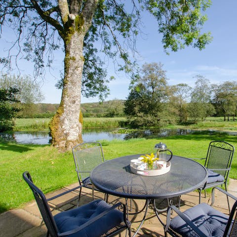 Sip your morning coffee in the serenity of your pondside patio