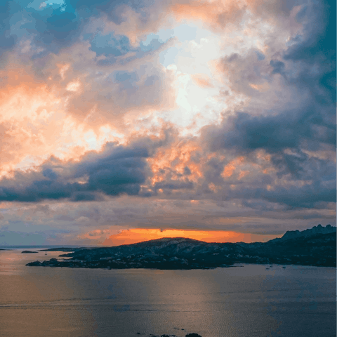 Watch the sunset from Cannigione, just a short drive away
