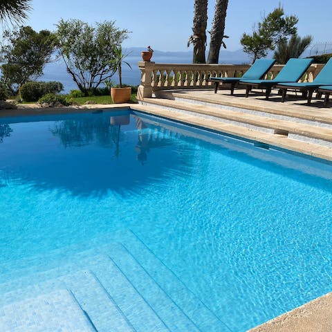 Dive into the sparkling waters of your pool to cool off from the midday sun