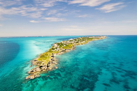 Take the ferry to Isla Mujeres for colourful streets and crystal Caribbean snorkelling