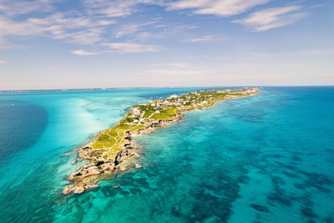 Take the ferry to Isla Mujeres for colourful streets and crystal Caribbean snorkelling