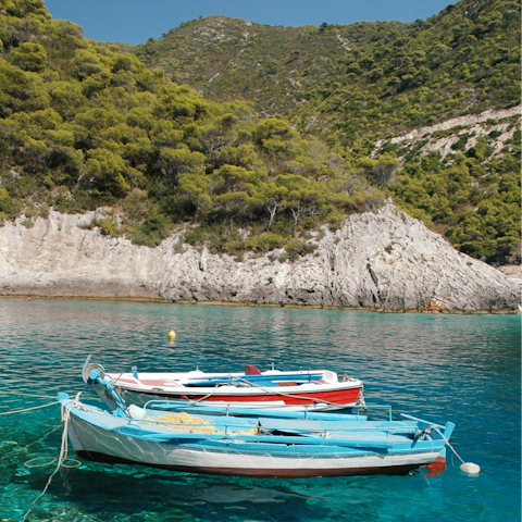 Discover the island's crystal-clear waters on a boat ride