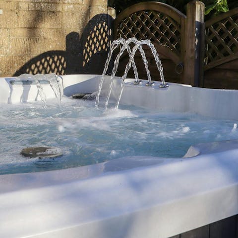 Soak in the sea-view hot tub after a day exploring the coast
