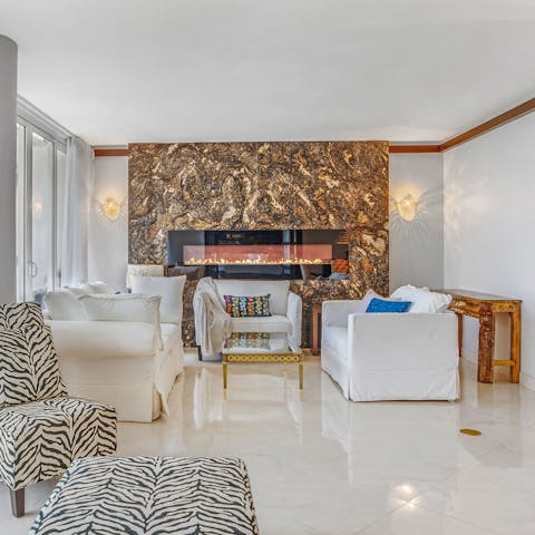 Cosy up by the stylish fireplace if the wind picks up outside