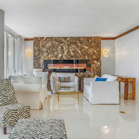 Cosy up by the stylish fireplace if the wind picks up outside