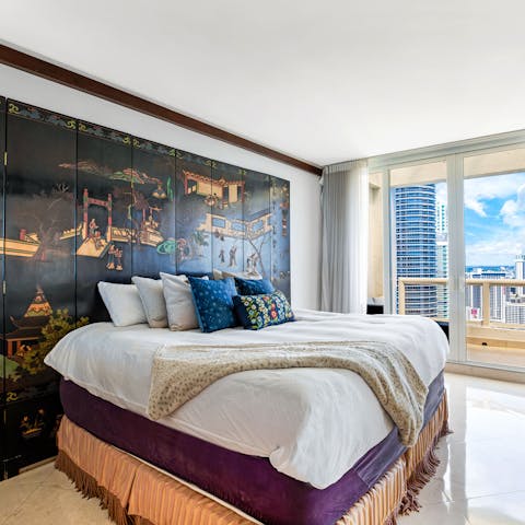 Wake up to ocean views from the Asian-inspired master bedroom