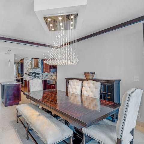Gather together at the elegant dining table for celebratory meals