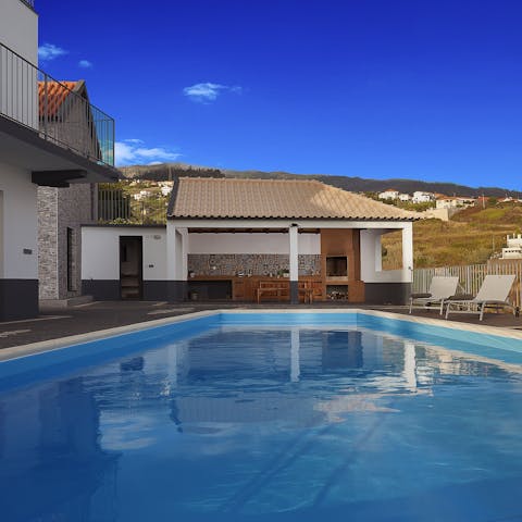 Play games in the heated swimming pool before drying off in the sunshine on a lounger