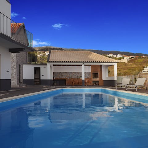 Play games in the heated swimming pool before drying off in the sunshine on a lounger