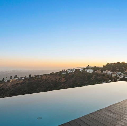 Slip into the infinity pool overlooking the city below