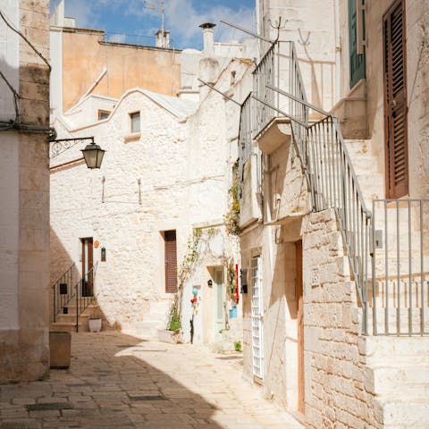 Explore the quaint streets of nearby Cisternino