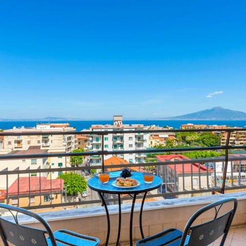 Enjoy breakfast on the balcony with distant sea views