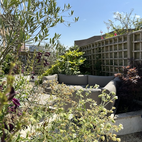 Wander through the landscaped garden to the garden studio