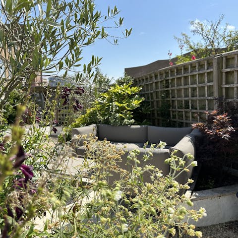 Wander through the landscaped garden to the garden studio