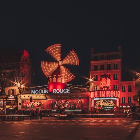 Visit the Montmartre district's iconic Moulin Rouge, a ten-minute walk away